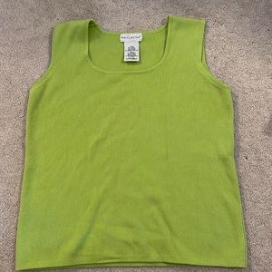 This is a vintage olive green tank top from “White Stag”. It is a women’s (8/10)